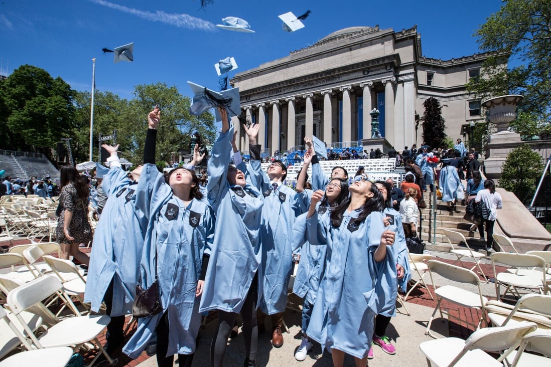 A group of Chinese graduates throw their hats into the sky after a commencement ceremony at Columbia University in New York, the United States on May 18, 2016. Photo: Xinhua