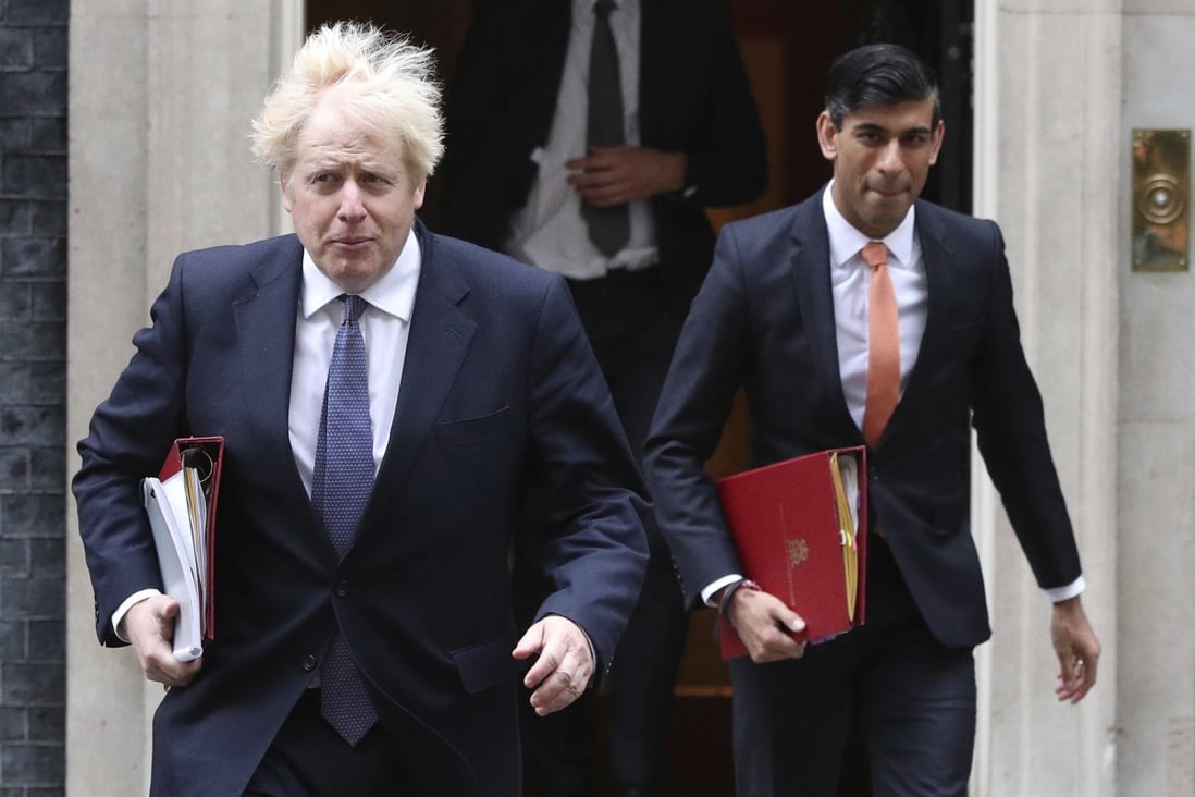Britain’s Prime Minister Boris Johnson, left, and Chancellor of the Exchequer Rishi Sunak leave 10 Downing Street on Tuesday. Photo: PA via AP