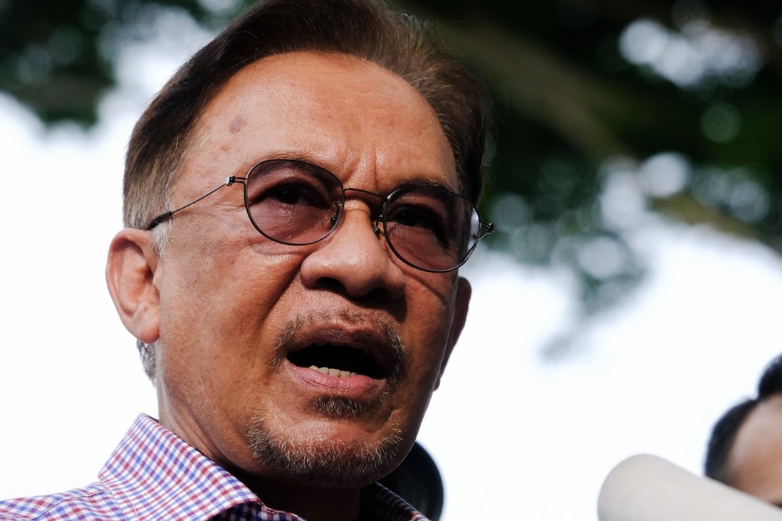 Anwar Ibrahim, founder and president of the People's Justice Party, speaks to the media after police questioned him mainly over the names of the members of parliament who support his bid to take over as prime minister. Photo: Bloomberg