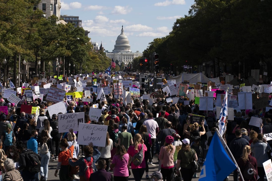 With the US Capitol in the background, demonstrators march on Pennsylvania Avenue during the Women's March in Washington. Photo: AP