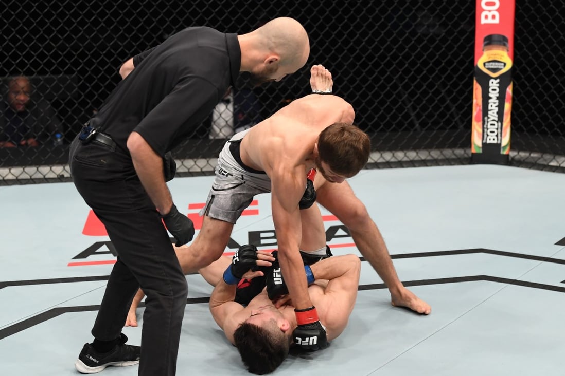Said Nurmagomedov punches Mark Striegl of the Philippines in their bantamweight bout during the UFC Fight Night event inside Flash Forum on UFC Fight Island on October 18, 2020 in Yas Island, Abu Dhabi, United Arab Emirates. Photos: Josh Hedges/Zuffa LLC via Getty Images
