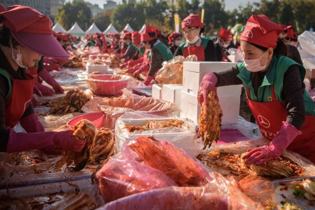 Volunteers take part in a kimchi making festival in Seoul in 2018. File photo: AFP