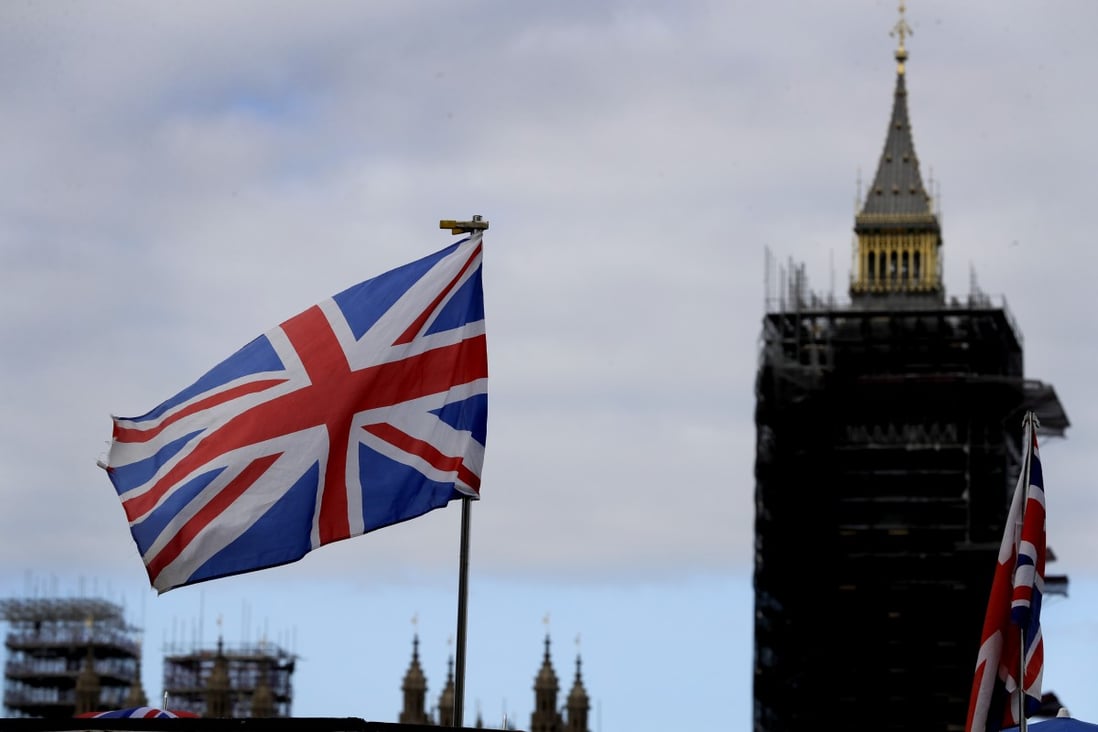 The Union flag flies in front of Big Ben in London on Friday. Photo: AP