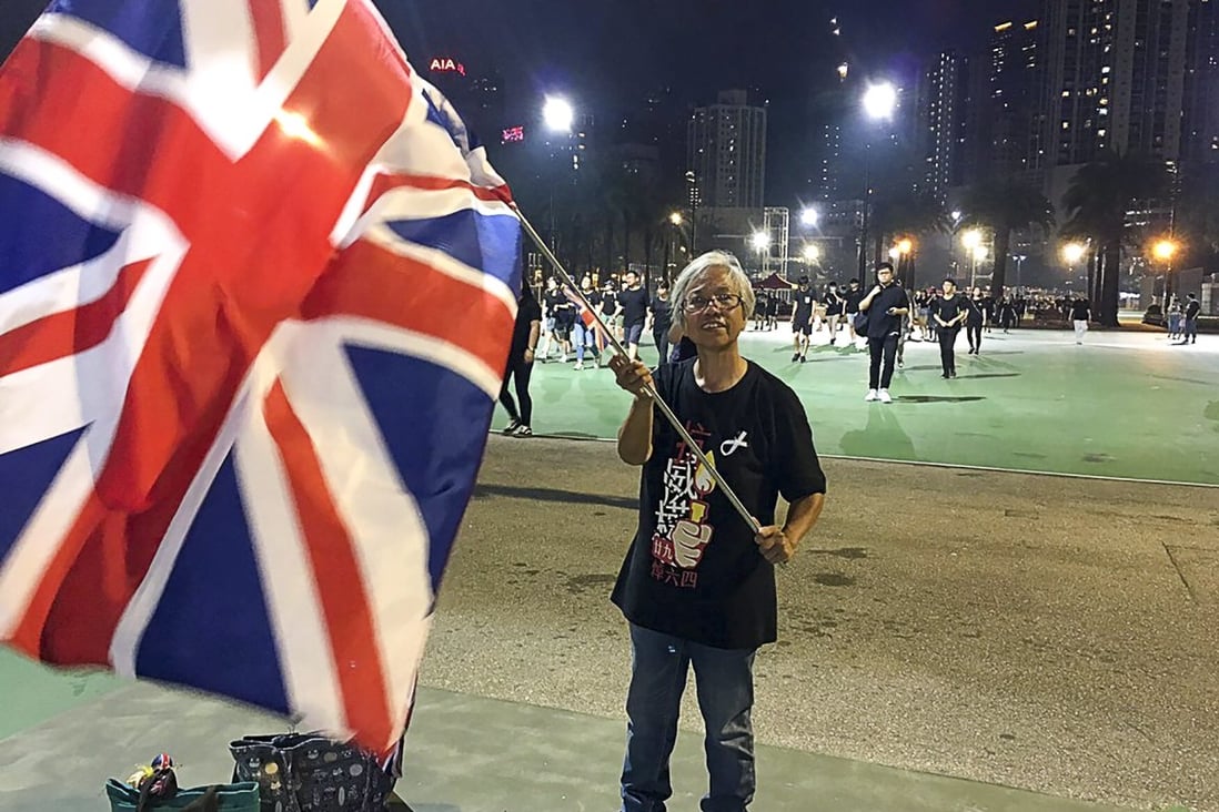 Alexandra Wong Fung-yiu poses with a Union flag in Victoria Park in June last year. Photo: SCMP