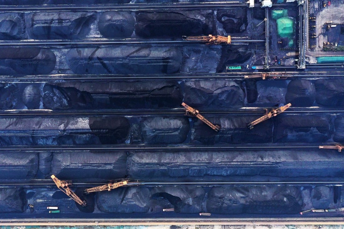 An aerial photo shows workers cleaning and transporting coal to a designated site inside the Shijiu Port Area of Rizhao Port in Rizhao City, in eastern China's Shandong province, in October 2019. Photo: Xinhua