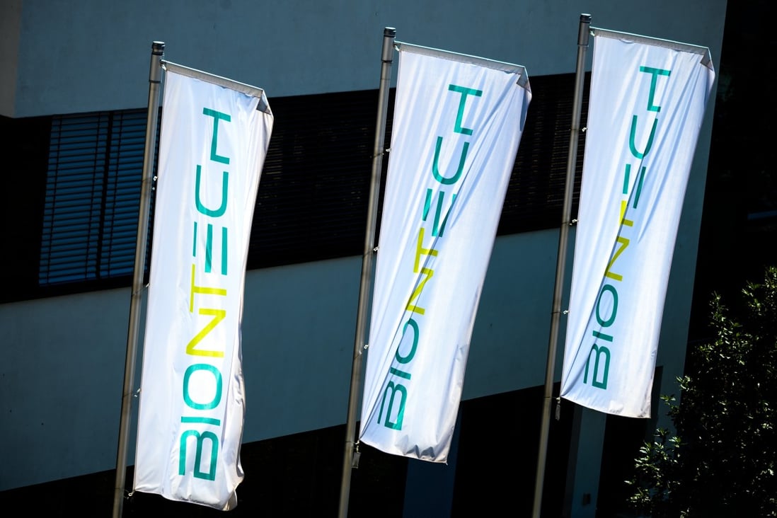The logo of BioNTech on flags in front of the company headquarters in Mainz, Germany. Photo: dpa