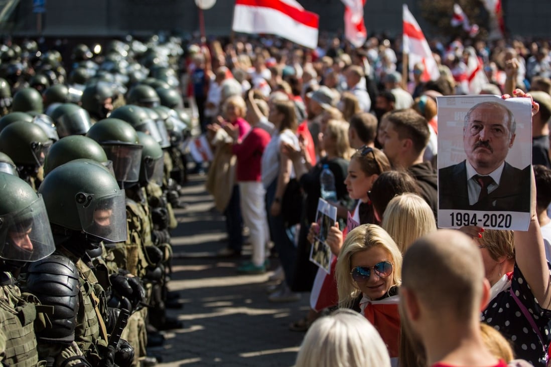 Belarusian servicemen block a street in Minsk on August 30 during a rally by opposition supporters protesting against disputed presidential election results. Tens of thousands of opposition supporters marched through the city calling for an end to strongman Alexander Lukashenko’s rule. Photo: TUT.BY/ AFP