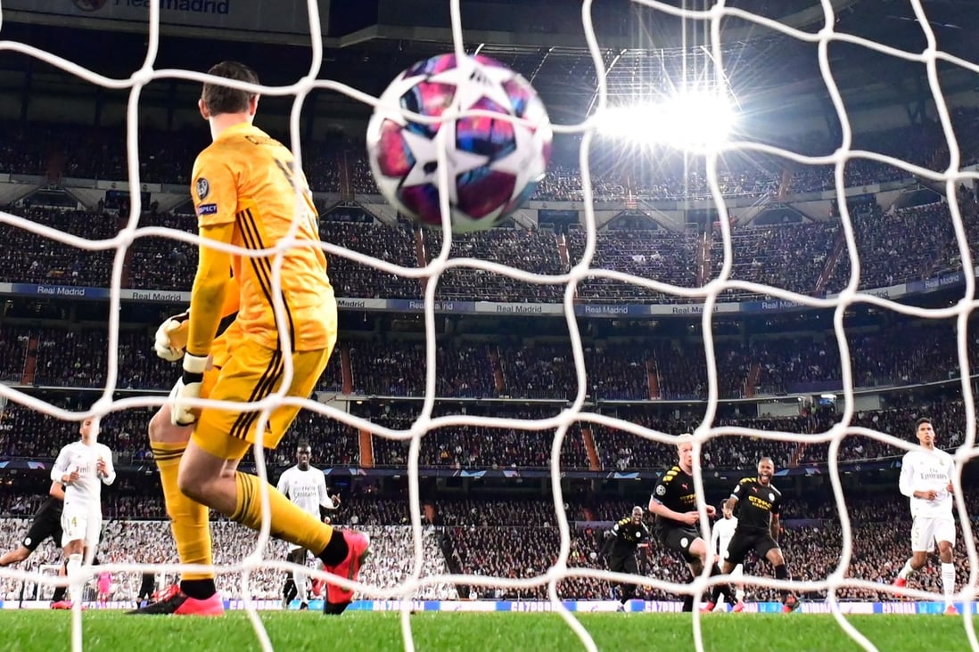 Manchester City midfielder Kevin De Bruyne’s penalty kick rests in the goal in the 2019-20 Uefa Champions League round of 16 match against Real Madrid. Photo: AFP