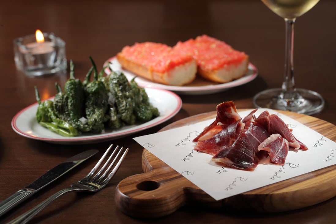 Iberico ham, Padrón peppers and tomato bread at Rubia. Photo: Alex Chan