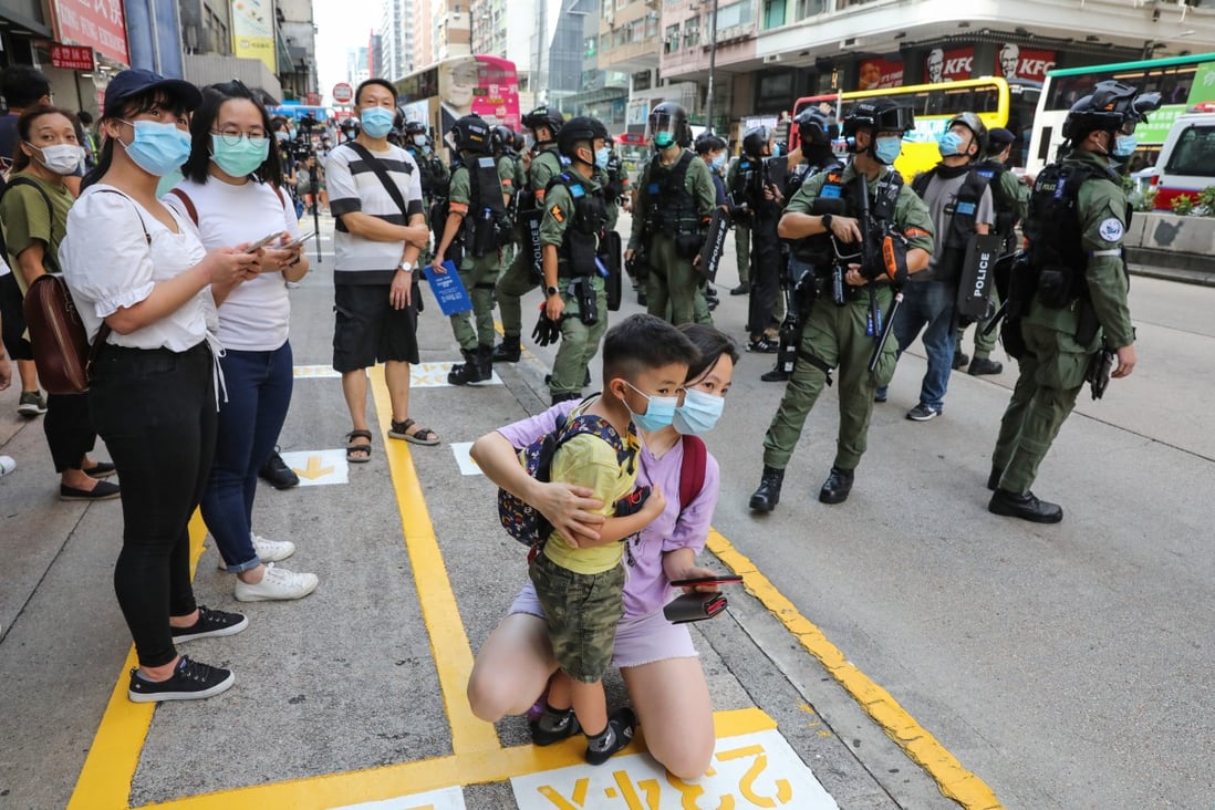 Police officers stand guard on Nathan Road in Hong Kong in September during protests against the new national security law. Photo: May Tse