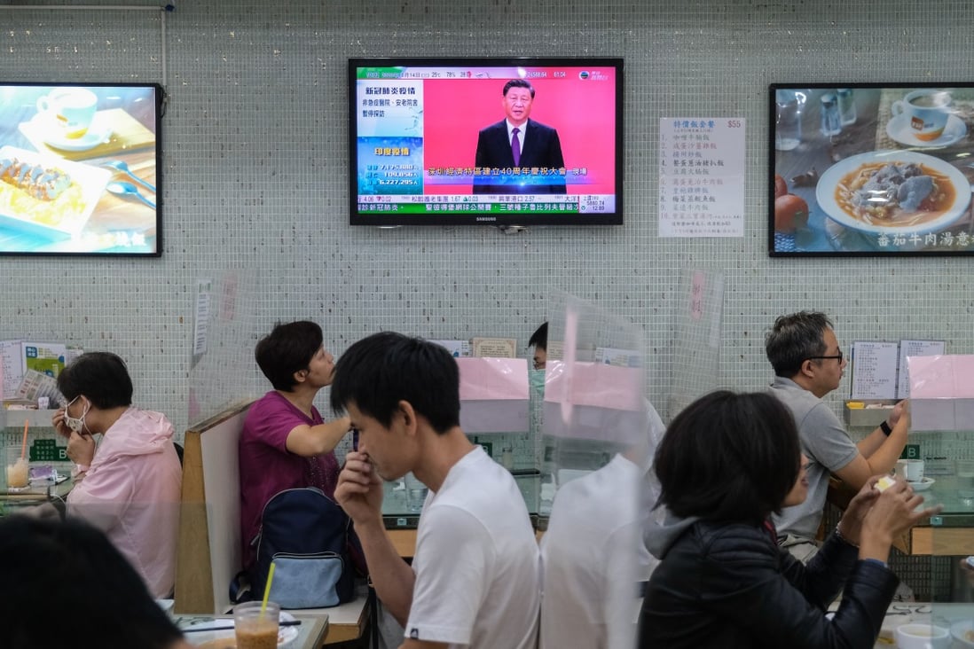 A TV screen at a Hong Kong restaurant shows the live broadcast of President Xi Jinping delivering a speech in Shenzhen on October 14, marking the 40th anniversary of the special economic zone. Photo: Bloomberg
