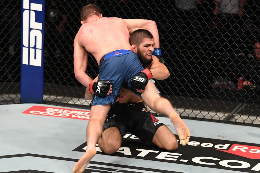 Khabib Nurmagomedov takes down Justin Gaethje in their lightweight title bout at UFC 254 on Fight Island in Abu Dhabi. Photo: Josh Hedges/Zuffa LLC via Getty Images