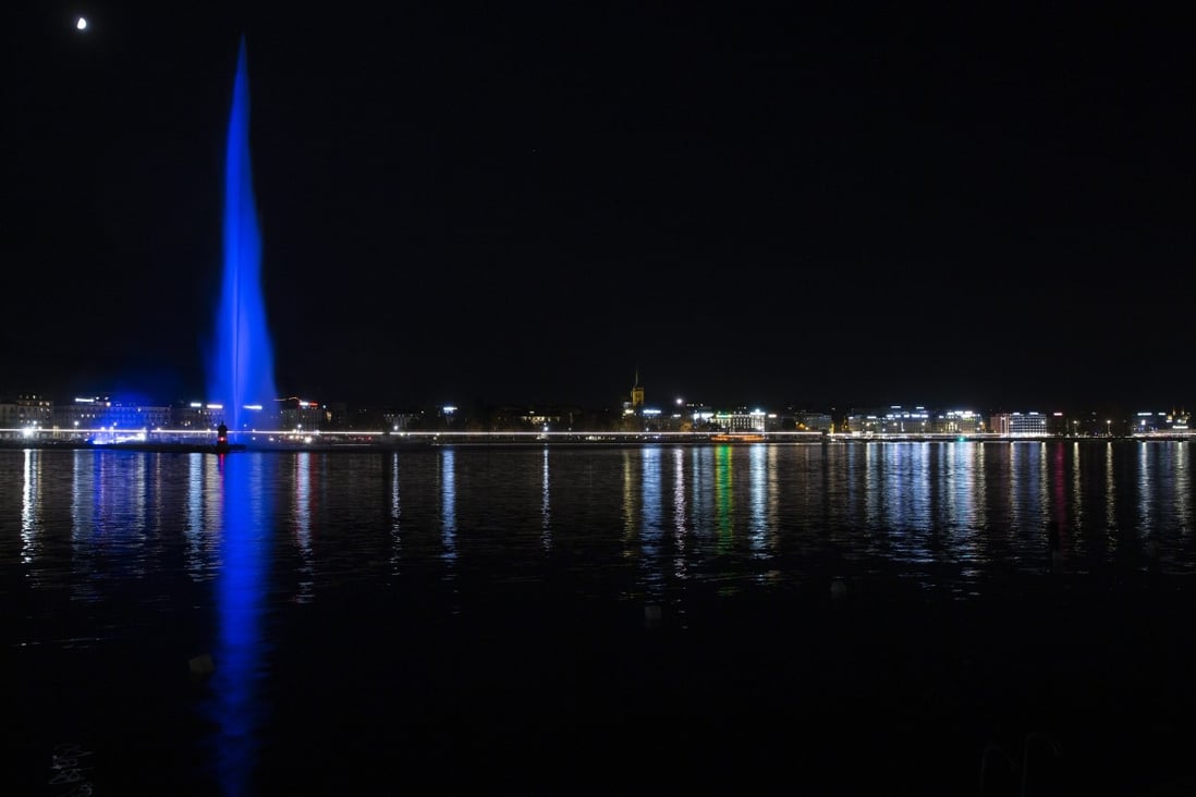 The water fountain 'Le Jet d‘eau' illuminated in blue to mark the 75th anniversary of the United Nations in Geneva, Switzerland on Saturday. Photo: EPA-EFE