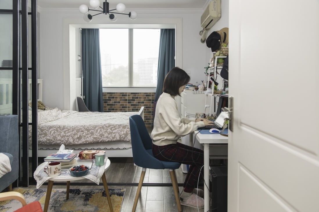 An employee works from her home in Shanghai on March 9. Asia has experienced less impact from the work-from-home revolution during the pandemic and instead could see a boom in office occupancy in the coming years as more supply becomes available. Photo: Bloomberg