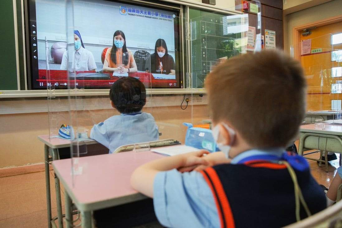 Dividers separate students at Yau Ma Tei Catholic Primary School during their first day of face-to-face classes in months. Photo: Winson Wong