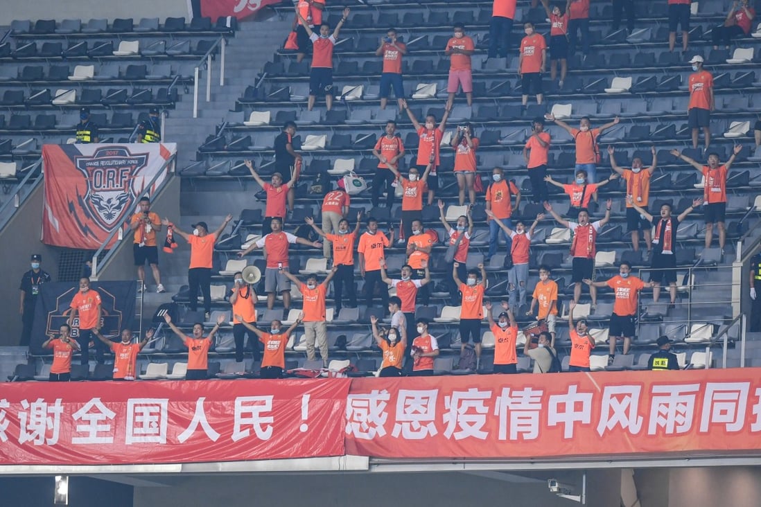 Wuhan Zall supporters cheer during a match against Beijing Guoan in the Chinese Super League in September. Photo: Xinhua