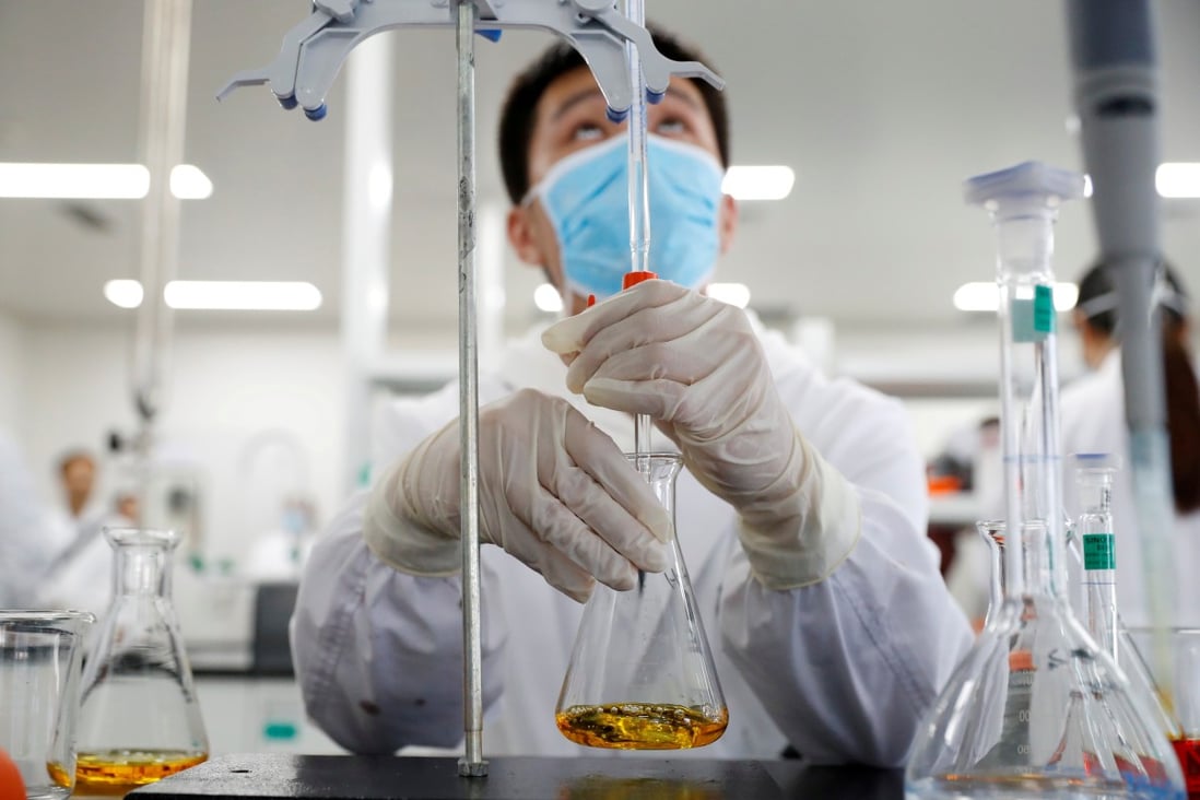An employee works at a Sinovac Biotech facility, which is developing an experimental coronavirus vaccine, in Beijing in September. Photo: Reuters