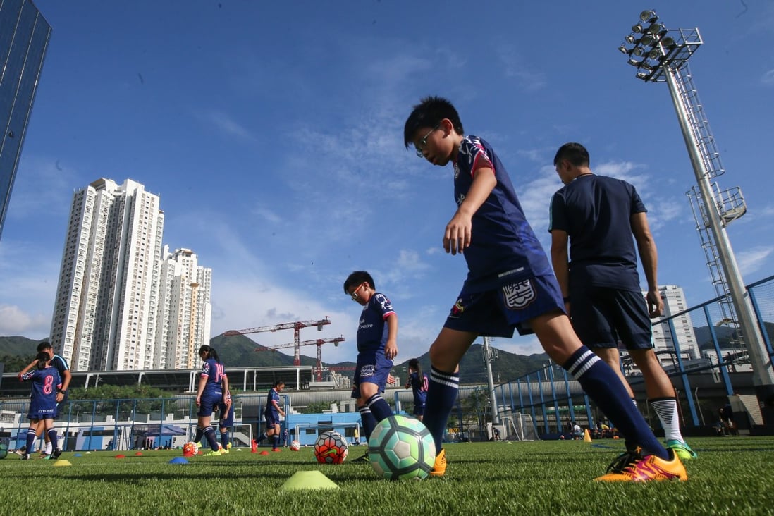 There is still a long way to go for Hong Kong football. Young children play at the Jockey Club Kitchee Centre in Shek Mun. Photo: David Wong
