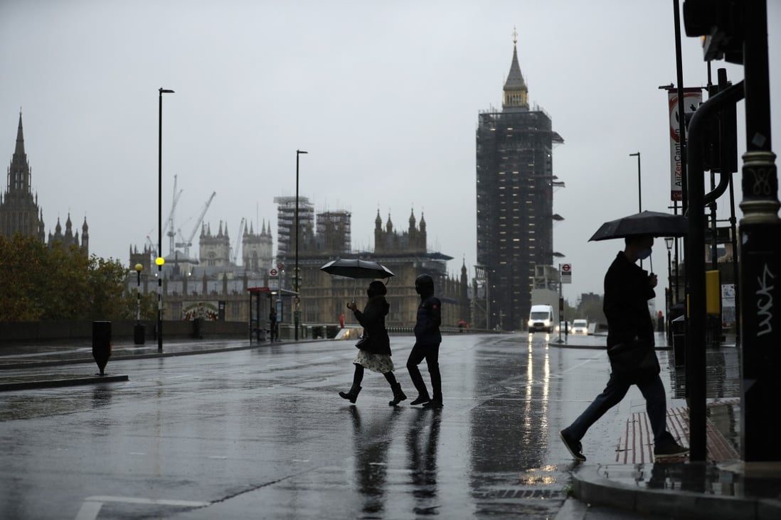 Pedestrians cross over the south side of Westminster Bridge in central London on October 21. The sight of Hongkongers leaving their vibrant, cosmopolitan city en masse for a cold, wet island could be an embarrassing one for Beijing. Photo: AP