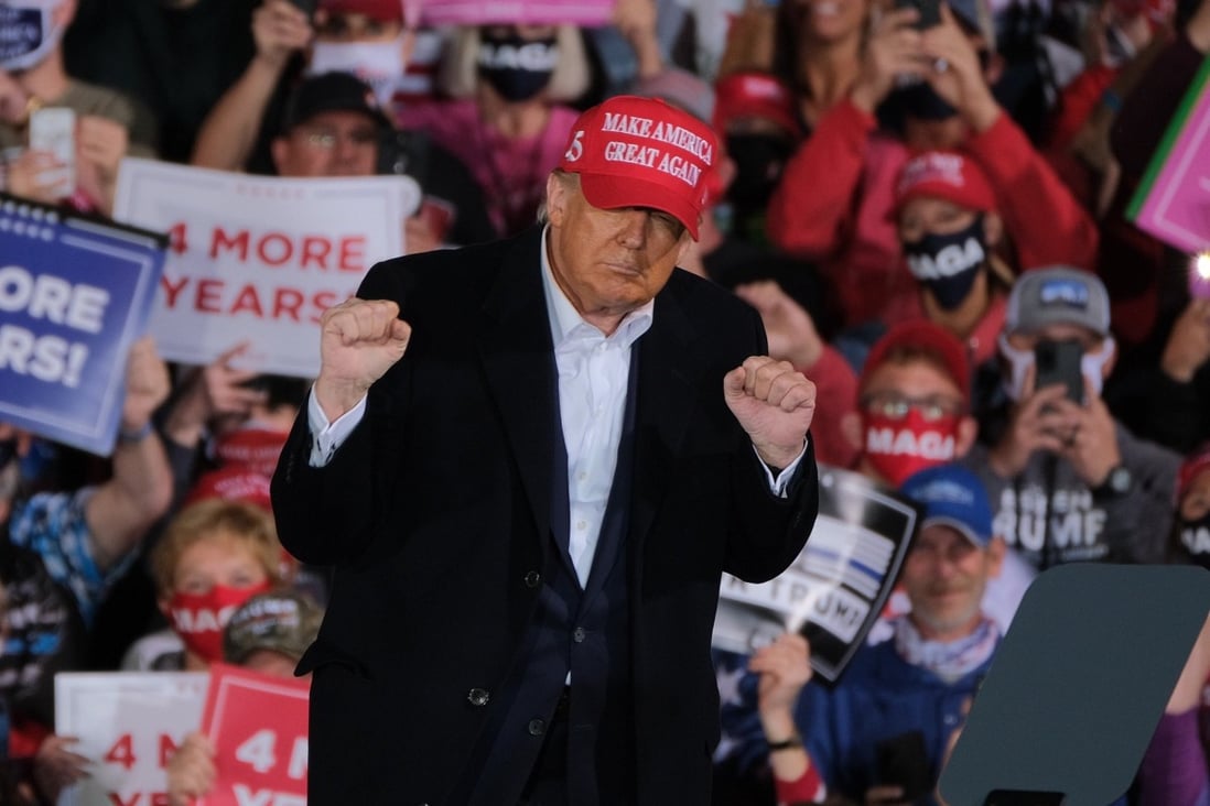US President Donald Trump dances during a campaign rally in Iowa on October 14. Photo: ZUMA Wire via dpa