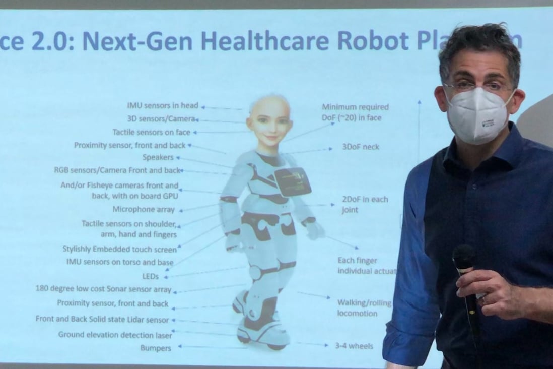 David Hanson who created Sophia the robot, shows a poster of Grace, the upcoming health care robot, designed to care for the elderly. Photo: Siqi Ji