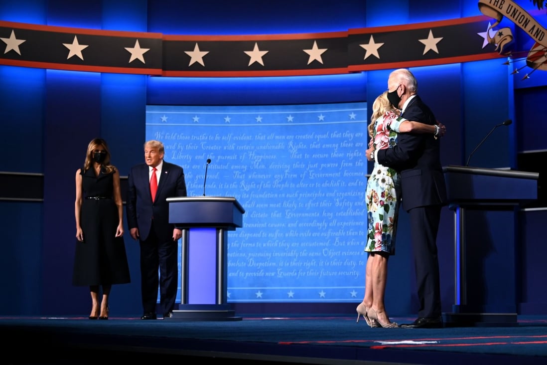 US First Lady Melania Trump stands with US President Donald Trump, as Jill Biden hugs husband and Democratic presidential candidate Joe Biden at the end of the final presidential debate in Nashville, Tennessee, on October 22. Photo: AFP