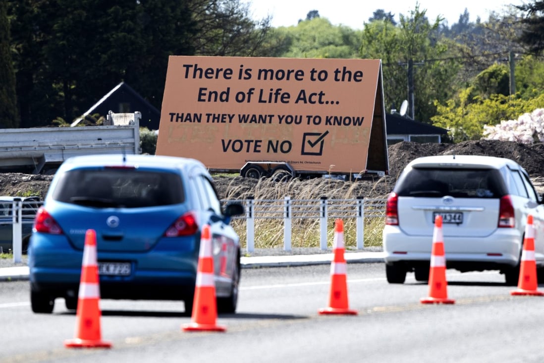 Cars pass a billboard urging voters to vote No against euthanasia in Christchurch, New Zealand. Photo: AP