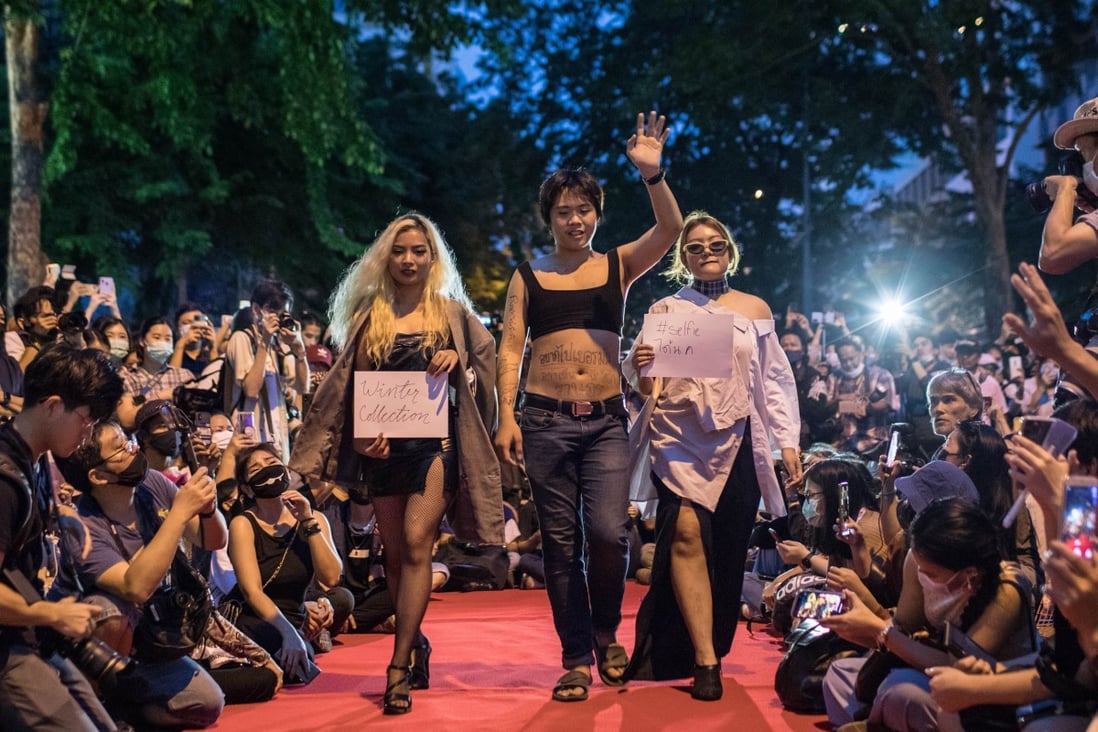 Thai pro-democracy protesters walk down the catwalk during a mock fashion show at an anti-government demonstration. Photo: Geem Drake/SOPA Images via ZUMA Wire/dpa