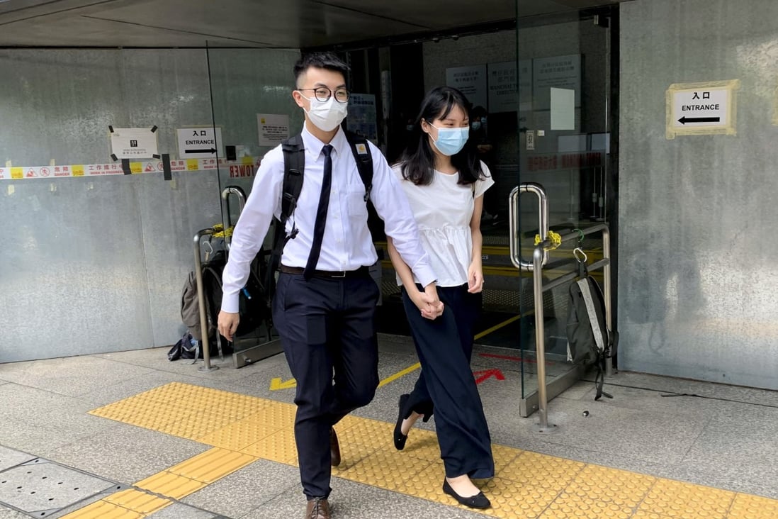 Yu Tak-wing and girlfriend Mok Ka-ching leave court following their acquittals of rioting charges on Saturday. Photo: Jasmine Siu