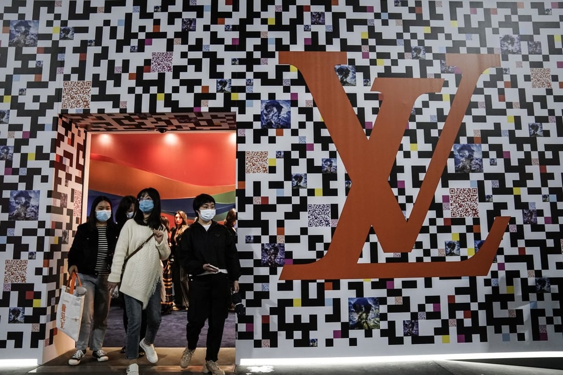 Visitors pass through the “See LV” exhibition in Wuhan. Leading luxury brand Louis Vuitton chose the Chinese city where the Covid-19 coronavirus first emerged to launch the global travelling show. Photo: Getty Images