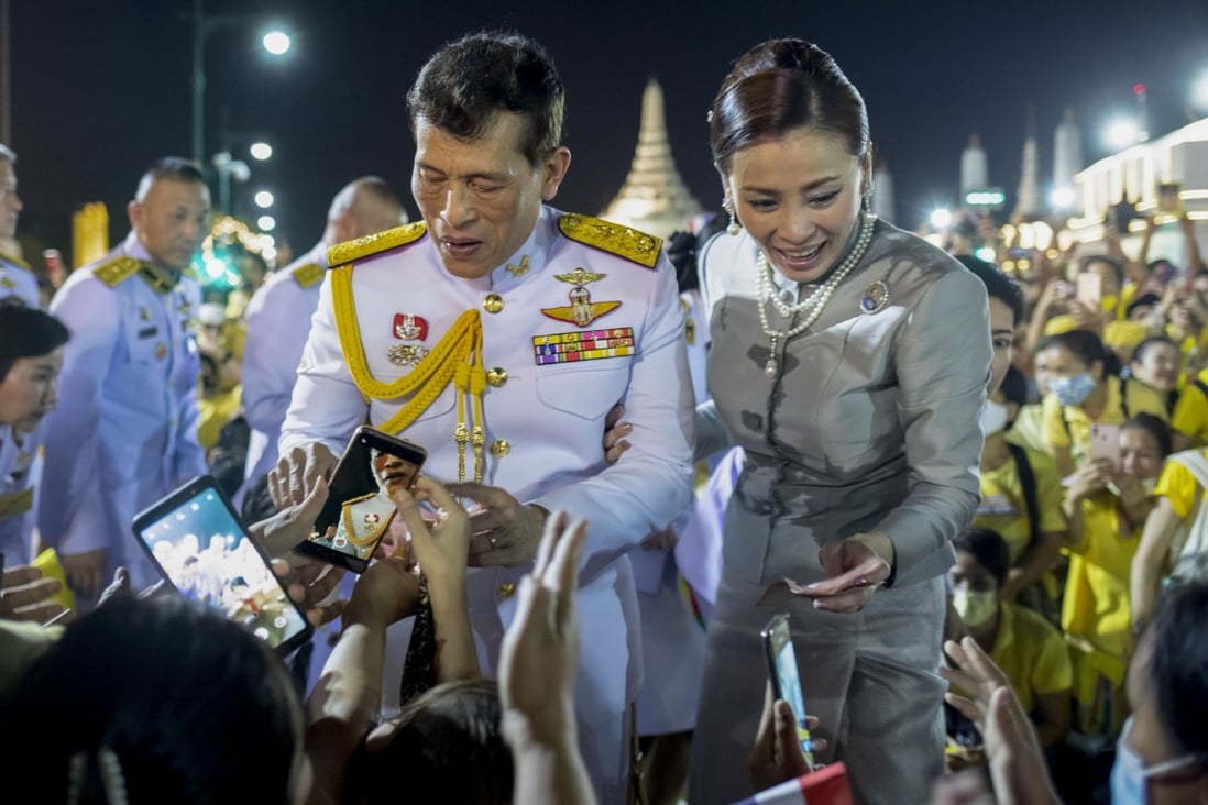 Thailand’s King Maha Vajiralongkorn and Queen Suthida greet royalists at the Grand Palace in Bangkok on Sunday. Photo: AP