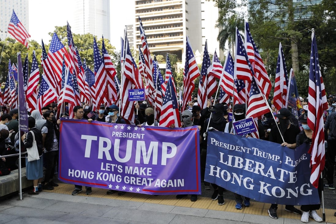 Hong Kong protesters carrying American flags and banners appeal to US President Donald Trump at a December 2019 rally. Photo: AP