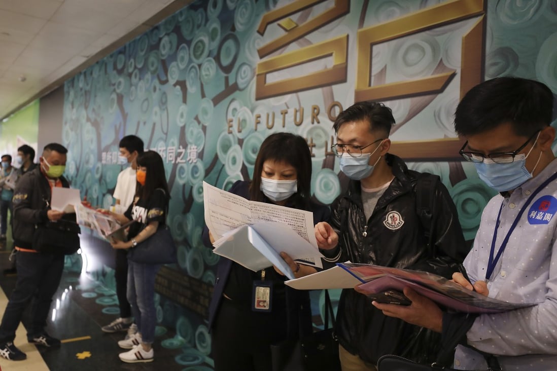 Potential homebuyers line up at a sales office in Tsim Sha Tsui, for CK Asset’s 98 units at El Futuro in Sha Tin. The frenzy in the property market stands in sharp contrast to Hong Kong’s ongoing recession and high unemployment. Photo: Xiaomei Chen