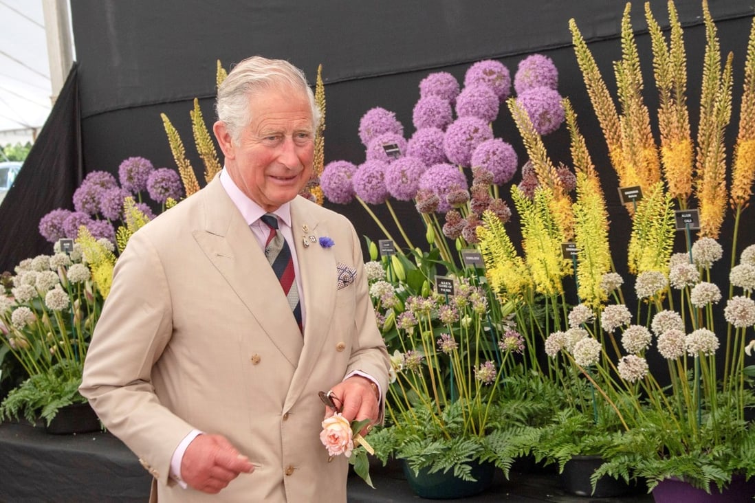 Britain's Prince Charles favours double-breasted suits, ties and matching handkerchiefs, and tells Vogue magazine: “People come round after 25 years to dressing like I do.” Photo: Arthur Edwards/Pool via Reuters