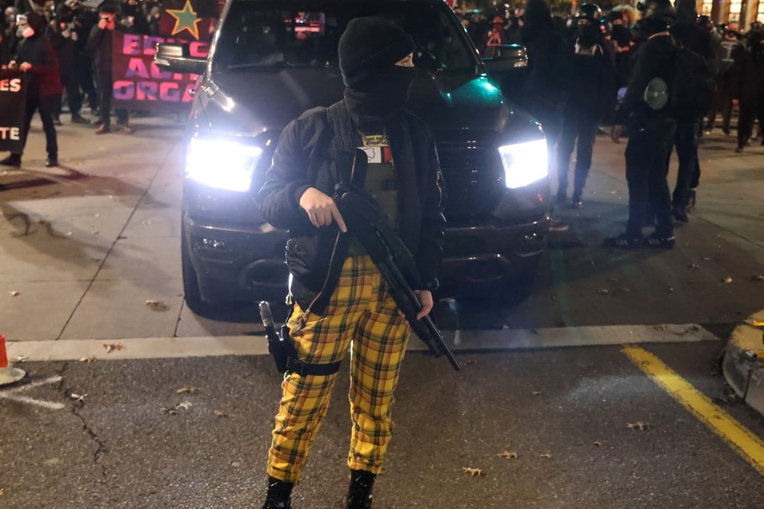 A demonstrator carries weapons during a protest on November 4, the day after US election day, in Portland, Oregon. Photo: Reuters