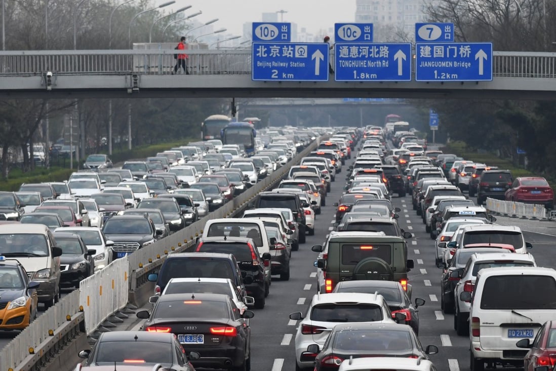 Cars crowd the second ring road in Beijing, as traffic gets back to normal after a two-month coronavirus-induced lockdown, on March 24. China is the world’s largest carbon emitter, with Japan at fifth and South Korea at seventh place. Photo: AFP