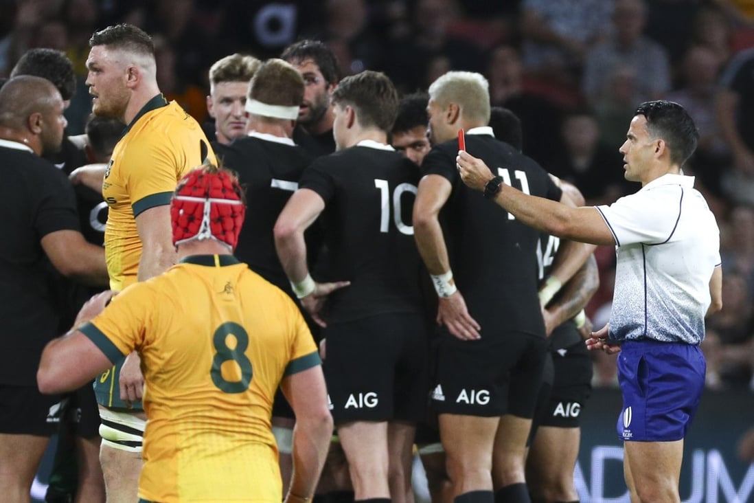 Referee Nic Berry shows a red card to Australia’s Lachie Swinton. Photo: AP