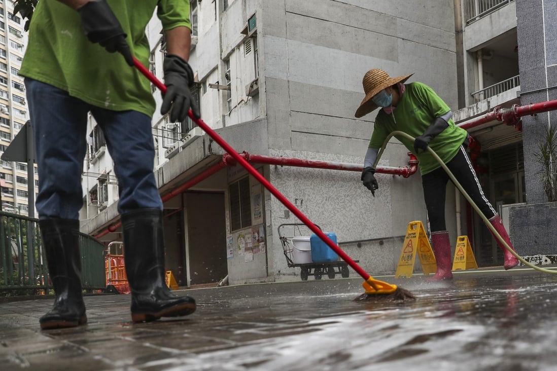 Cleaners wash the grounds of Yau Oi Estate in Tuen Mun after rats were found with Hepatitis E in 2019. Photo: Sam Tsang