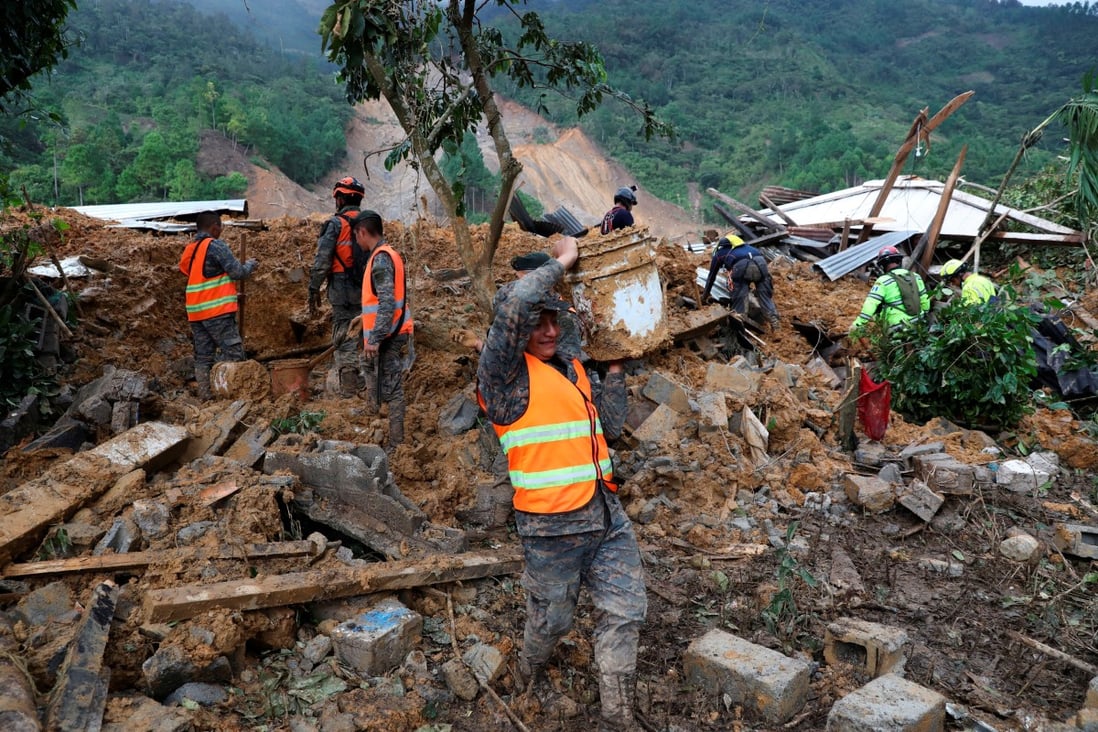 Soldiers remove debris and mud from a landslide caused by heavy rains brought by Storm Eta as the search for victims continues in the buried village of Queja, Alta Verapaz, Guatemala. Photo: Reuters