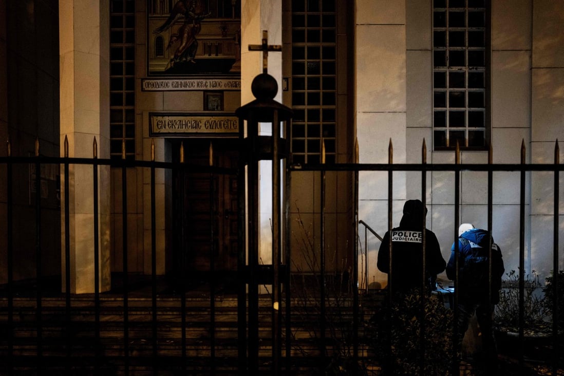Police officers examine the entrance of the Orthodox Church in Lyon, France, where an attacker armed with a sawn-off shotgun wounded an Orthodox priest on October 31. Photo: AFP