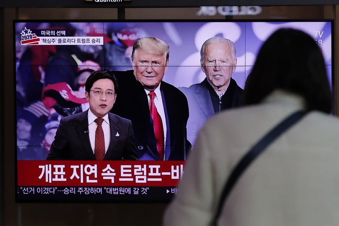 A TV screen shows images of US President Donald Trump and Democratic presidential candidate Joe Biden in Seoul on Wednesday. Photo: AP