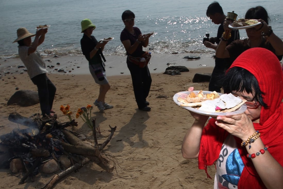 Followers of Tibertan Buddhism attend a religious ritual on Lamma Island on the first anniversary of Lamma ferry collision tragedy. Photo: SCMP