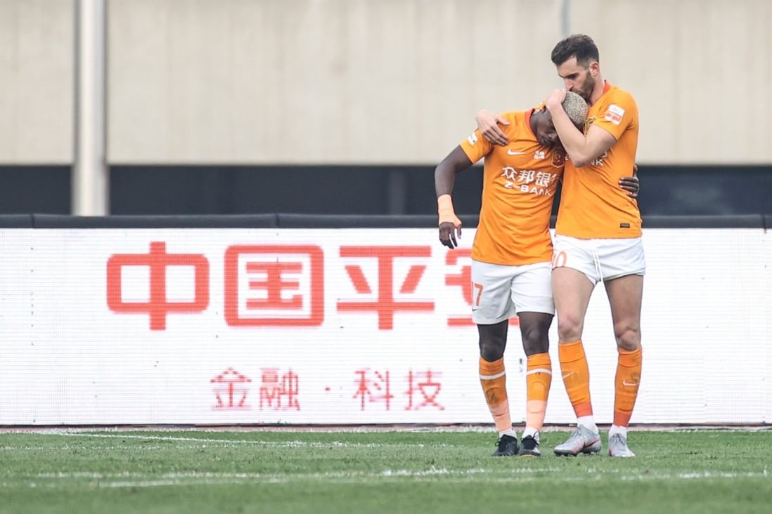 Wuhan’s Jean Evrard Kouassi (left) celebrates his goal with Leo Baptistao in their Chinese Super League match against Shijiazhuang Ever Bright in Dalian. Photo: Xinhua