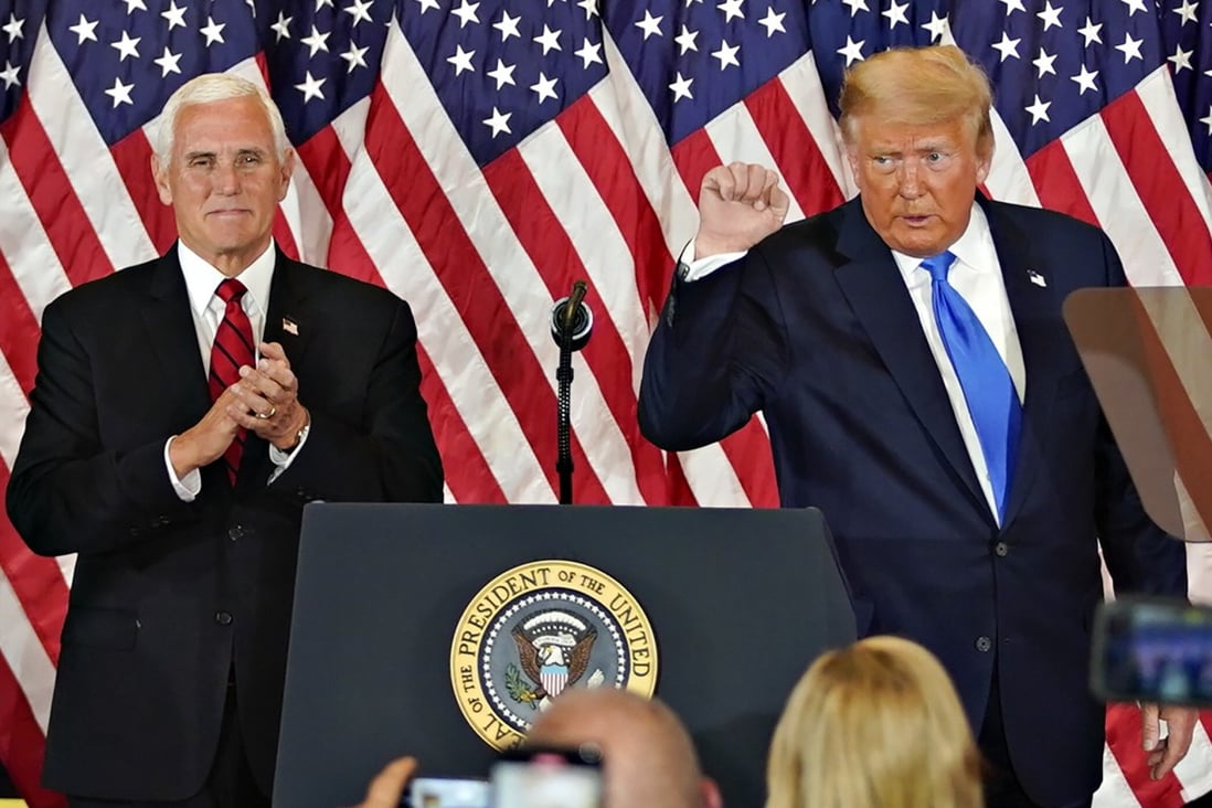 US President Donald Trump pictured with Vice-President Mike Pence, left, at an election night party – one of the last times he spoke in public. Photo: Bloomberg