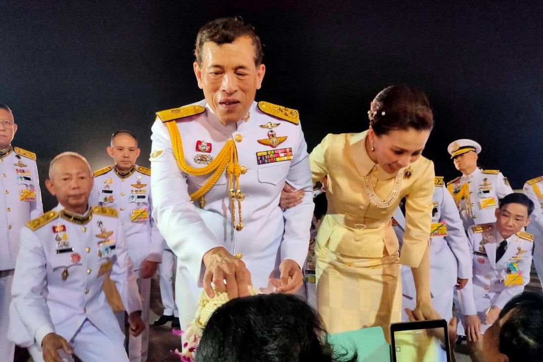 Thailand’s King Maha Vajiralongkorn and Queen Suthida greet royalists at an airport in Udon Thani province. Photo: Reuters