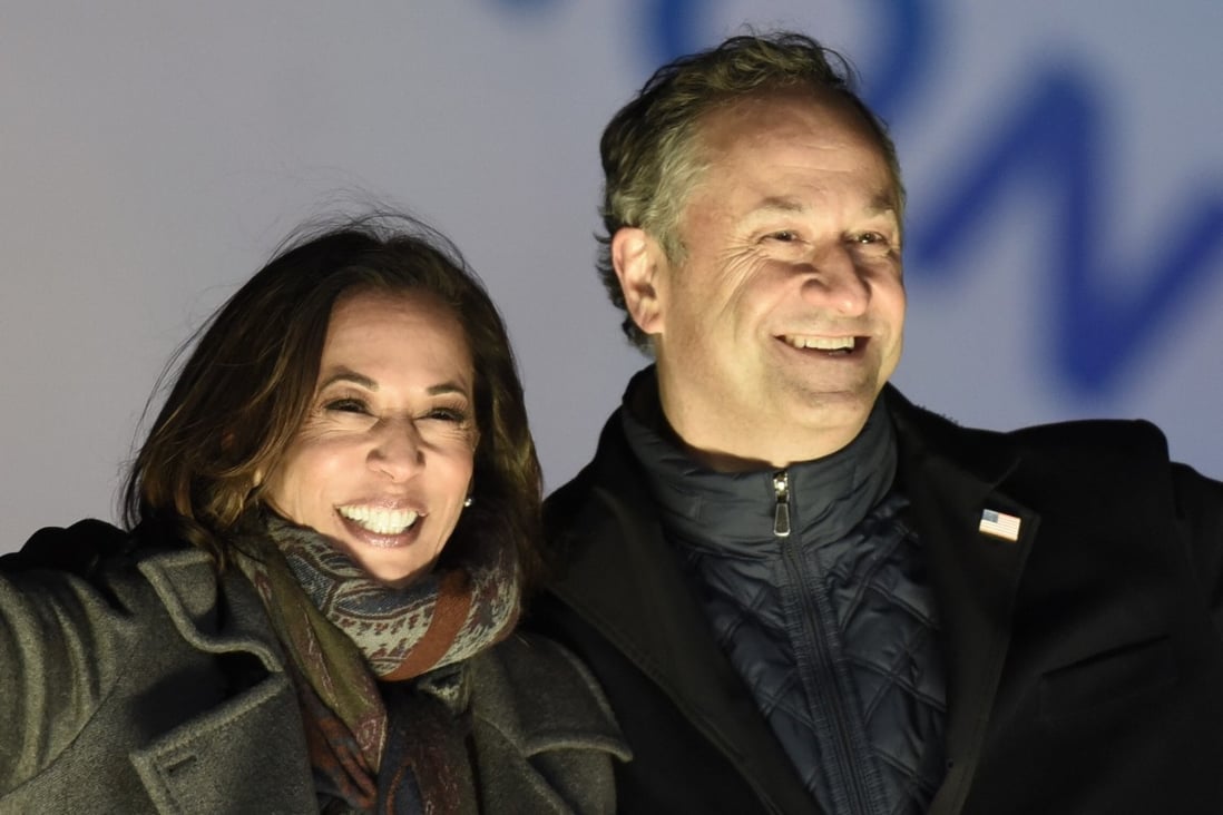 Kamala Harris and her husband, Doug Emhoff, take the stage during a rally in Philadelphia on November 2. Photo: AP