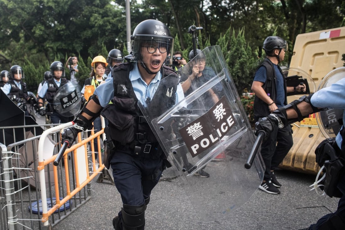 Protesters clash with police in Sheung Shui on July 13, 2019. Officers were among the targets of doxxing, the publishing of personal information on the internet with malicious intent. Photo: Getty Images