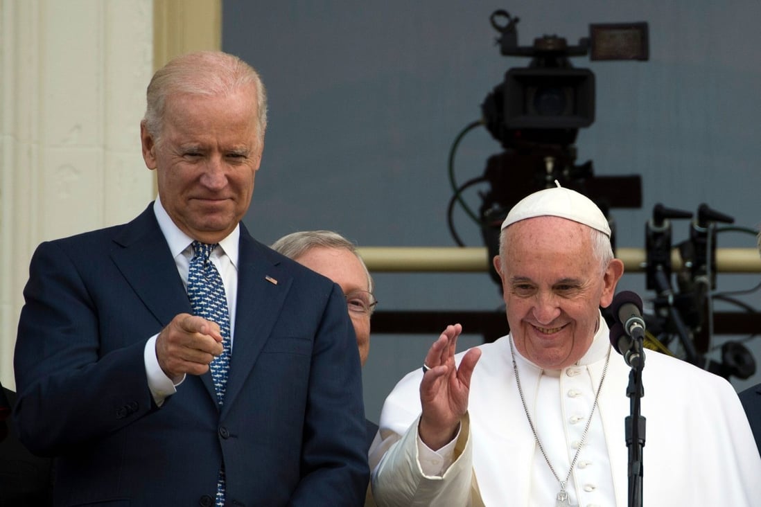 Pope Francis, with then US Vice-President Joe Biden, waves from the US Capitol balcony in September 2015. Photo: AFP