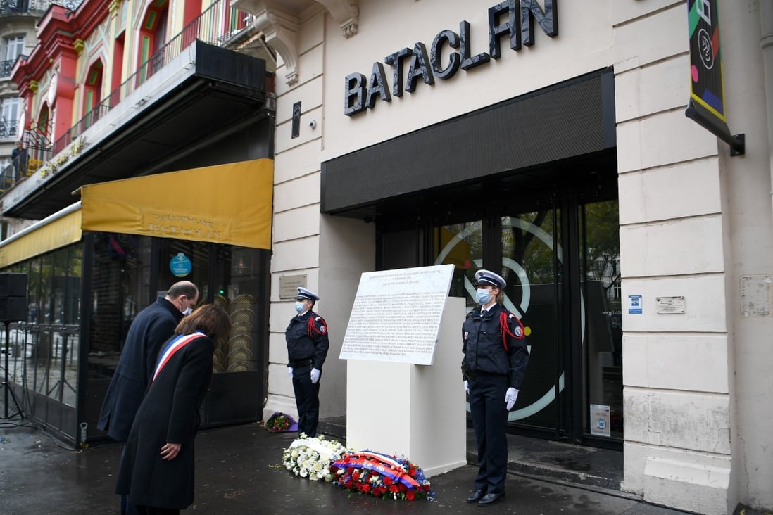 French Prime Minister Jean Castex and Paris Mayor Anne Hidalgo lay a wreath outside the Bataclan concert venue on Friday. Photo: Reuters