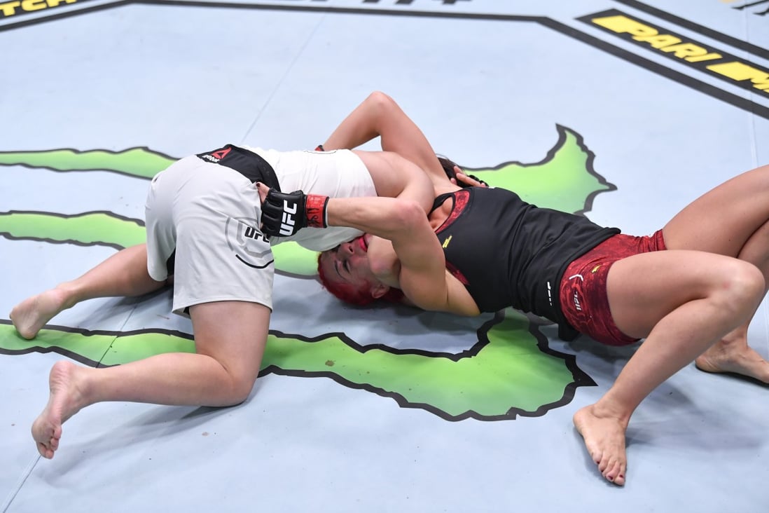 Japan’s Kanako Murata attempts to secure a choke submission against Randa Markos in a strawweight fight at UFC Fight Night in Las Vegas. Photos: Jeff Bottari/Zuffa LLC